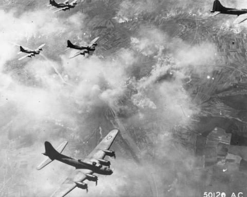 Black & white image of airplanes in clouds